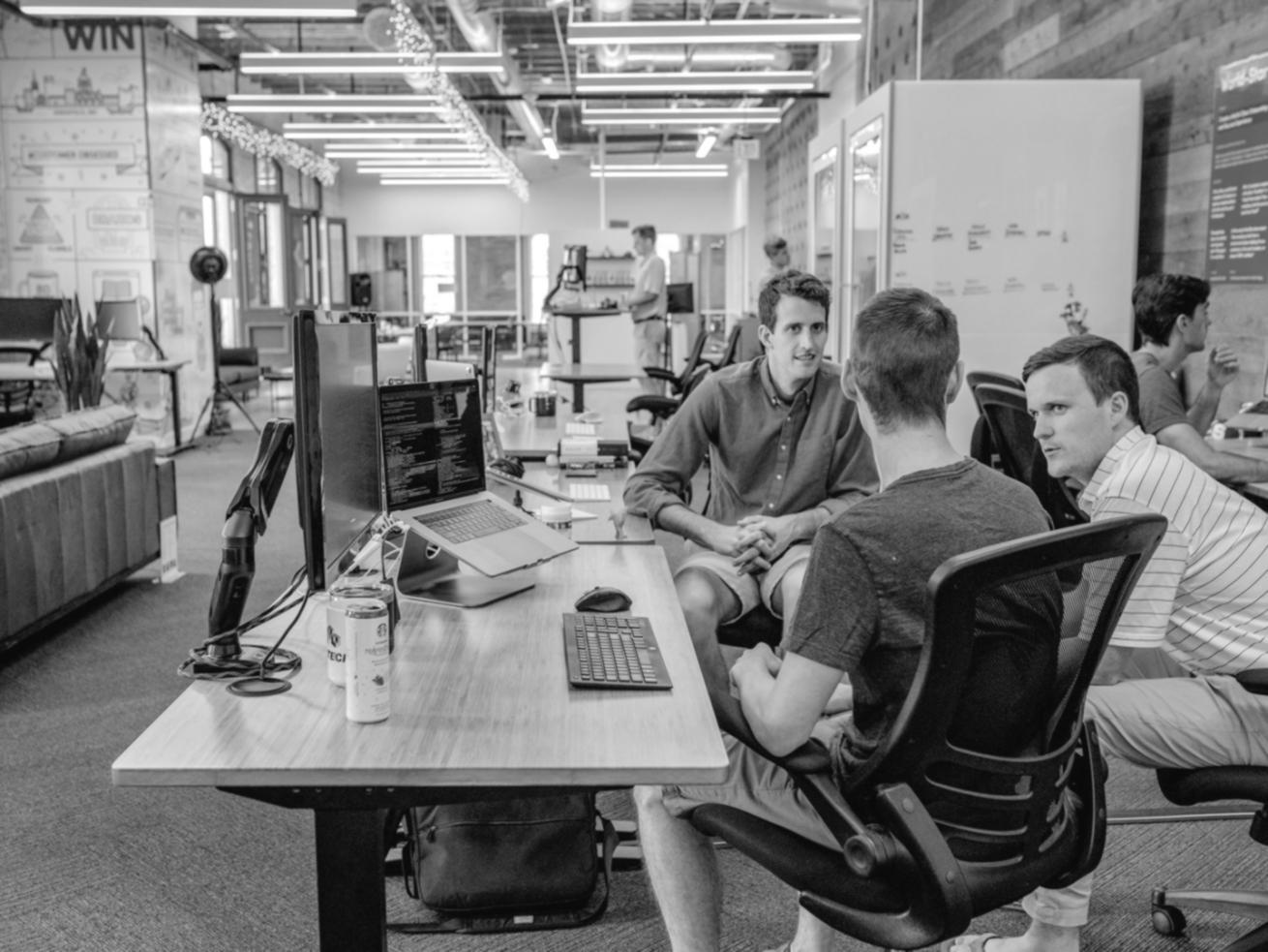 Students debugging code together using professional development tools and methodologies